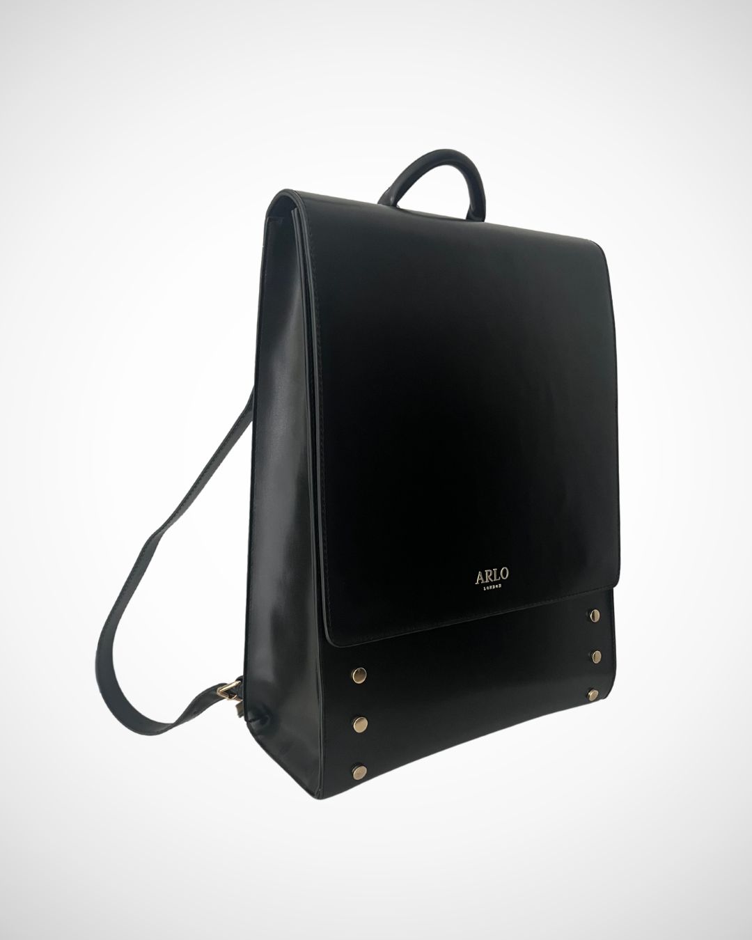 Smart and sophisticated black structured vegan leather backpack / rucksack for laptop with separate compartments including pen loops, zipped inner pocket, smooth patent cruelty-free material for work / office use. Quiet luxury, minimal, mid luxury affordable simple design. Adjustable straps for comfortable wear.