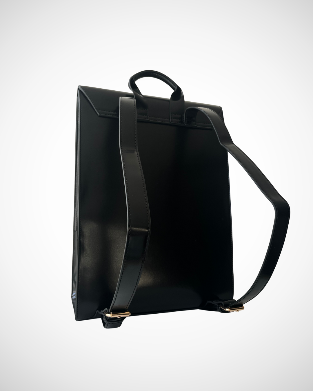 Smart and sophisticated black structured vegan leather backpack / rucksack for laptop with separate compartments including pen loops, zipped inner pocket, smooth patent cruelty-free material for work / office use. Quiet luxury, minimal, mid luxury affordable simple design. Adjustable straps for comfortable wear.