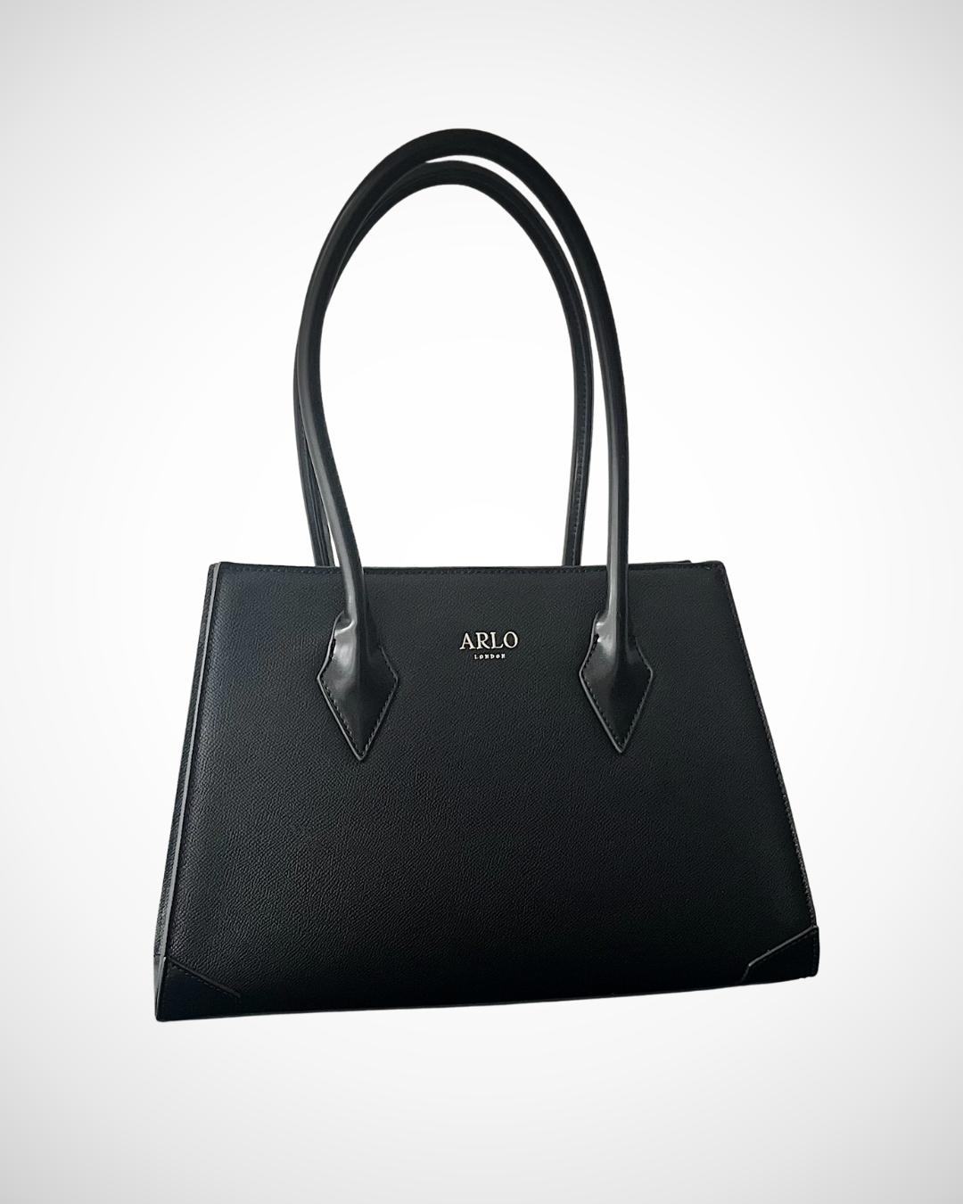 smart sophisticated black structured trapezium tote handbag for work made from vegan leather with separate compartments for organisation, long handles to wear on shoulder or on the arm, plain, office appropriate, spacious, mid luxury, quiet fashion
