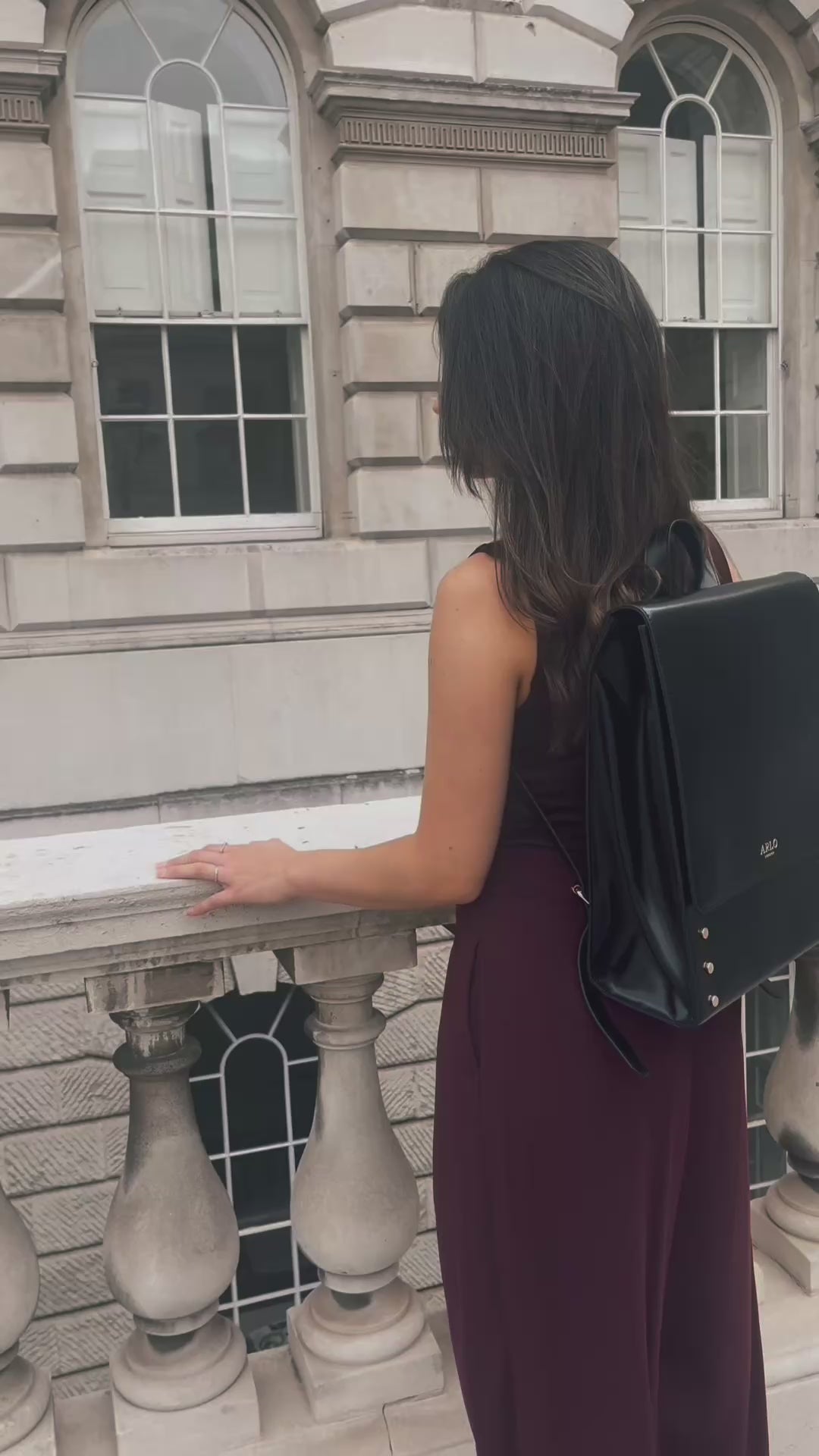 Load video: A collection of black structured work bags for professional women including a tote and a backpack suitable for laptop created by ARLO London